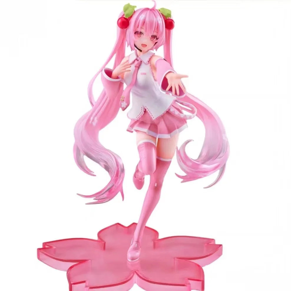 Figura de uma personagem de anime Hatsune Miku Sakura com cabelo rosa longo, trajes rosa e branco, segurando uma flor de cerejeira, em uma pose animada e alegre.