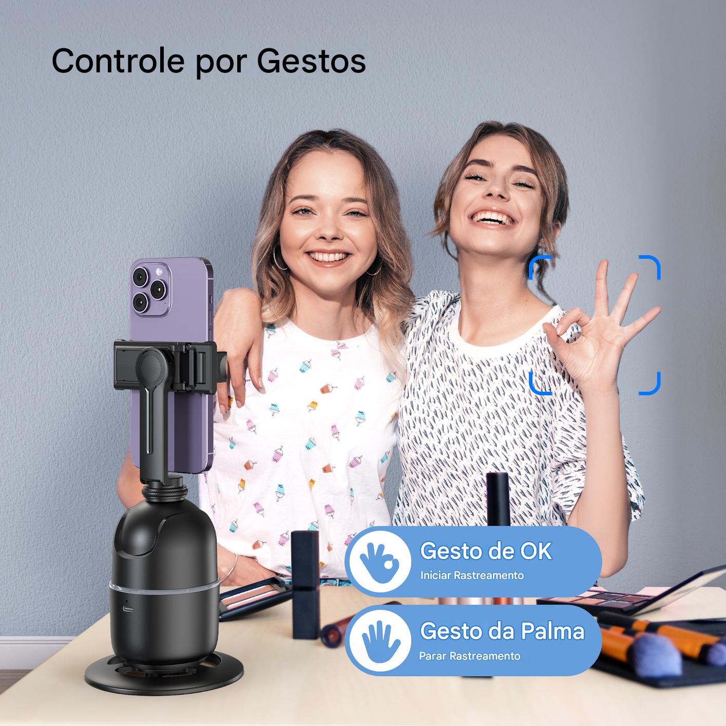 Duas jovens mulheres se divertindo e controlando um suporte de câmera por gestos, demonstrando tecnologia de controle por gestos com reconhecimento de gestos de OK e palma, no contexto de facilitar a captura de fotos e vídeos de forma prática e moderna.