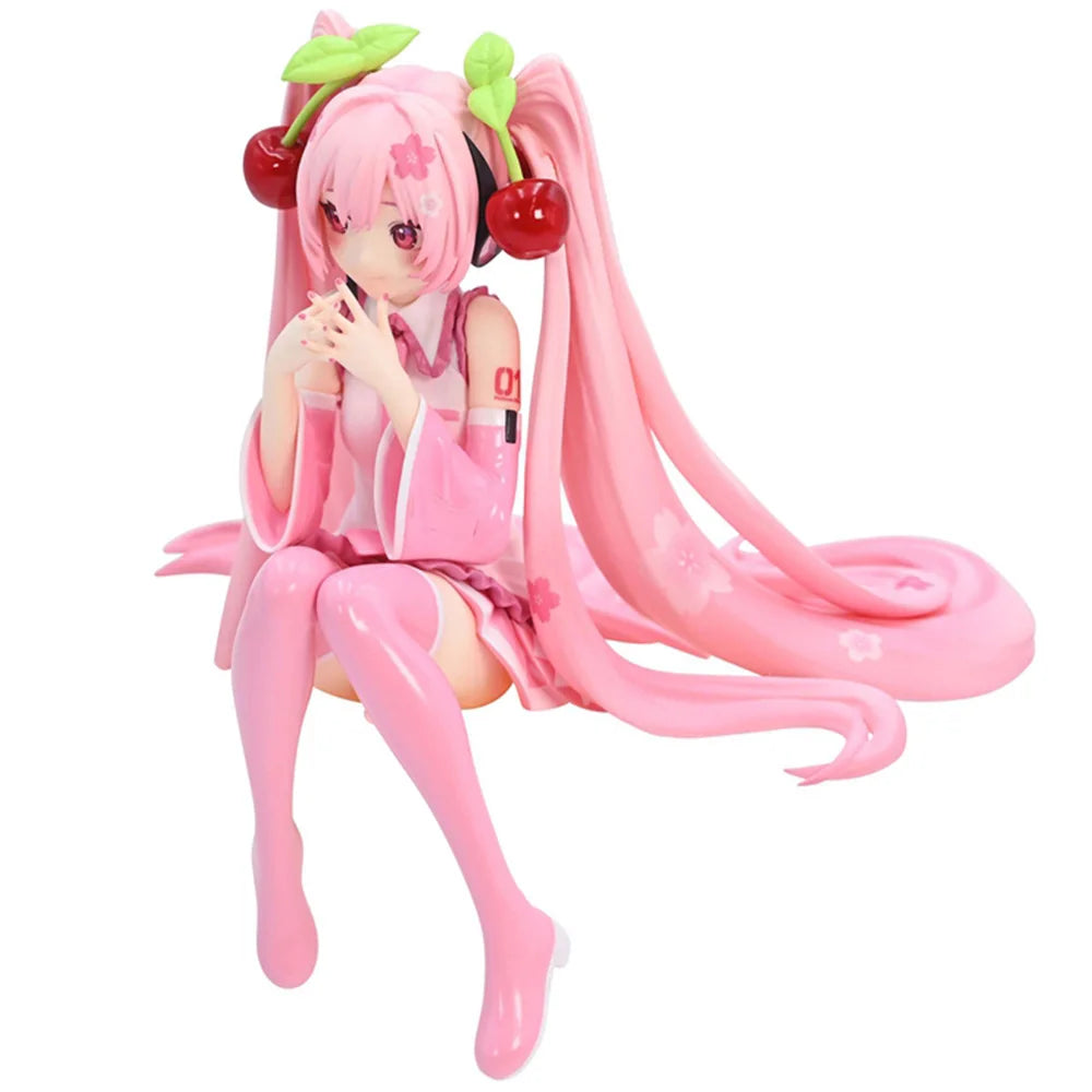 Figura de uma personagem Hatsune Miku de anime com cabelos longos e rosa, usando roupa rosa e acessórios com cereja, sentada em uma pose delicada.